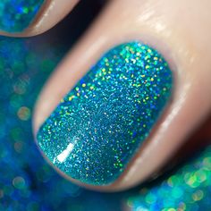 Surfboard is a tropical turquoise blue nail polish that’s absolutely perfect for a sunny day outdoors!  Loaded with an assorted size of holographic goodness, Surfboard beautifully sparkles like magic in the sun. Don’t forget to wear your shades!  Easily built up or sandwiched, the sheer formula of our jellies make way for our scattered holographic micro-flakes to work their magic all the way through each layer right down to your nails! The end result is a super crisp and sparkly finish with unmi Ilnp Nail Polish, Jelly Nail Polish, Jelly Nail, Acrylic Nail Polish, Tattoos Unique, Nail Collection, Turquoise Nails, Spring Acrylic Nails, Perfect Manicure