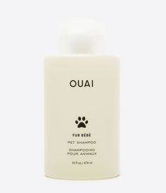 a bottle of shampoo for dogs on a white background with the word ouai written in