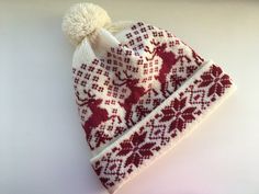 This winter hat with Norwegian pattern is extra warm, protecting a head in cold and windy weather. This winter hat has a 100% merino inner making it comfortable to wear. All wool items in my shop are washed and ironed, which make them clean and soft - Ready to wear! Material: 100% wool Colour: White/Red Sizes: *Head circumference: 54-56cm (21.26-22.05in) *Head circumference:57-59 cm (22.44- 23.23 in) You can also order a scaft in the same pattern here: https://www.etsy.com/listing/647605298/norw Red Winter Hat As A Gift, Handmade Beanie For Winter Gift, Hand Knitted Hat For Winter Gift, Handmade Beanie As Winter Gift, Handmade Winter Bonnet As A Gift, Handmade Winter Bonnet As Gift, Winter Beanie Hat As Gift, Winter Beanie Gift, Handmade Winter Bonnet Gift