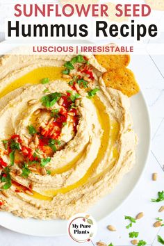 a white plate topped with hummus and tortilla chips