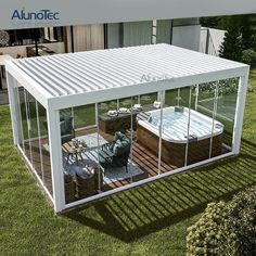 an outdoor hot tub enclosure with glass walls