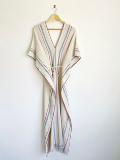 These super soft cotton tunic dresses are handmade in Sayulita, Mexico. This knee length dress is reversible can be worn with ties or without. Comes in two colors: natural white and red & blue stripe. Handmade by Quiut, Sayulita MX. One size Width - 20 ", length - 57", V-neck depth - 12" 100% natural cotton Photos with models courtesy of Quiut. Maxi Beach Dress, Cotton Tunic Dress, Tunic Dresses, Cotton Tunic, Beach Maxi Dress, Cotton Maxi, White And Red, Pitcairn Islands, Beach Dress