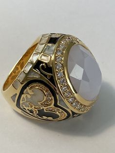 Lauren G Adams Crystal Enamel Renaissance Statement Ring Sz 9 New. Beautiful goldtone ring with a center bezel set oval milky white crystal and clear crystal halo. Sides are done in black and pearlized white enamel hearts with a fleur de lis design and squares. Size 9 1 1/8” by 1 “ 1 1/8” tall New unworn condition Ships in Lauren G Adams gift box and pouch Moonstone Rings, Antique Jewelry Rings, Jewelry Fashion Trends, Milky White, White Crystal, Moonstone Ring, Men's Rings, White Enamel, Fun Things