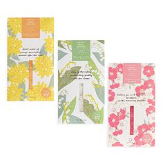 three greeting cards with flowers on them, one in pink and the other in yellow