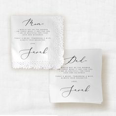 two wedding napkins with the names of their guests