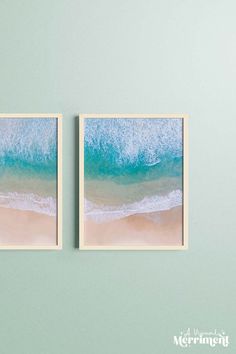 two framed pictures hanging on the wall next to each other with water and sand in them