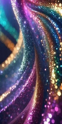 an abstract background with colorful lights and sparkles in the dark blue, green, pink, yellow and purple colors