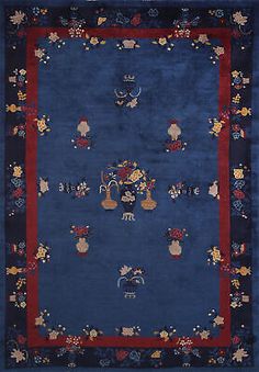 a blue rug with flowers and animals on it