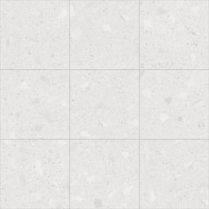 a white tile wall with some spots on it