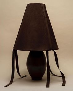 a lamp with a brown shade on it