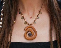 Handmade necklace with wooden spiral decorated with colorful beads. It is a very special unique piece. I carved the spiral by hand from the original piece of wood and then treated it with natural oil. The oil protects the pendant from external influences and keeps it looking beautiful for a long time. The pendant is attached to a waxed cotton cord with an adjustable length. ✺ CARE INSTRUCTIONS: Please remove the necklace before showering or swimming. Mandala Earth jewelry is a natural product an Skateboard Jewelry, Rice Necklace, Wood Necklace Pendant, Earth Jewelry, Cloth Brand, Natural Jewelry, Natural Oil, Wood Necklace, Nature Jewelry