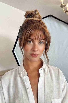 Top Knot Loose Updo with Face-Framing Bangs Bangs Square Face Shape, Updo Round Face, Bangs Square Face, Top Knot Updo, Knot Updo, Updo With Bangs, Braid Updo