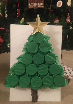 2 pieces of green tissue paper cover the red solo cups to create this treeInside you can place whatever items you wantmoneylottery ticketscandygift cardslumps of coalkids toysetcFor the game you can number and let each person pick a number to punch and that keeps the gifts close to the same amount or you can play high low card and whoever gets the highest card gets to punch a cup and keep what is in sideThis can be fun for children and adults of all ages. Shop Board, Fun Christmas Games, Christmas Punch, Christmas Games For Family, Family Christmas Party