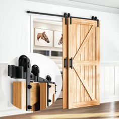 an open sliding barn door in a white living room with wood floors and wooden flooring