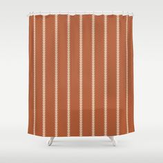 an orange shower curtain with white lines on it