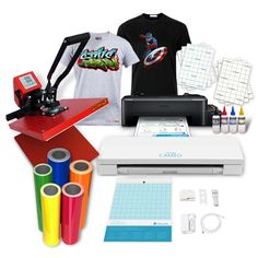 an assortment of crafting supplies including a t - shirt, cricut machine and other items