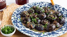 a blue and white plate topped with mushrooms