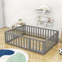 a baby's room with a gray crib and white rug on the floor