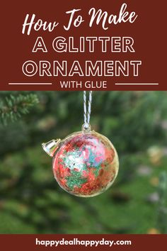 an ornament hanging from a christmas tree with the words how to make a glitter ornament with glue