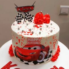 a birthday cake decorated with the character cars