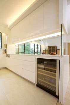 an empty kitchen with white cabinets and counter tops is seen in this image from the inside