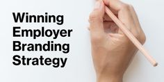 a person writing on a piece of paper with the words winning employee branding strategy above it