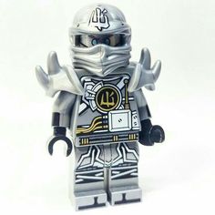 a lego figure wearing a helmet and holding his hands up