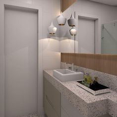 a bathroom with marble counter tops and white walls