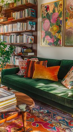 a living room filled with lots of furniture and bookshelves covered in colorful art