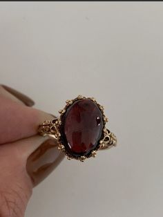 Absolutely stunning genuine natural Garnet ring. Please find for sale an extremely fine 9ct gold large heavy Victorian style cabochon garnet ring. The ring weighs 5.4grams. It has makers mark NK. It is fully hallmarked. Set with a beautiful large cabochon Garnet, of stunning colour approx 5ct. Also exceptional gold work. The face of the ring measures 13 x 9mm. The ring weighs 5.4grams heavy . It is ring size O 1/2 / USA size 7 1/2 and is offered in good condition Such a beautiful eye catching an Antique Engagement Rings Edwardian, Big Ring Designs, Gold Vintage Rings, Garnet And Pearl Ring, Antique Ring, Red Garnet Ring Vintage, Vintage Ruby Ring, Ornate Gold Rings With Ruby, Gold Garnet Ring Vintage