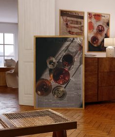 there are three wine glasses on the table and one is in front of a newspaper