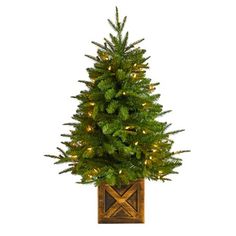 Create your own mini Christmas wonderland and rock around with this Artificial Christmas Tree. Incredibly lifelike textured branches mimic real evergreens for a sturdy construction. This pre-lit artificial Christmas tree comes with 50 clear lights and has upward-sloping branches  allowing you to decorate with mini-ornaments of your choice easily. Standing 3ft. from a decorative planter, this tree requires zero maintenance, just some fluffing and shaping thats easy with the bendable branches! Dec Faux Christmas Trees, Warm White Lights, Fir Christmas Tree, Pre Lit Christmas Tree, Cone Trees, Mini Ornaments, Christmas Greenery, White Lights, Decorative Planters