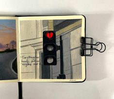 an open book with a traffic light on it