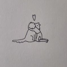 a drawing of a cat and a dog sitting next to each other on a piece of paper