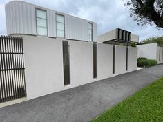 a white house with black shutters on the front and side walls that are lined up against each other