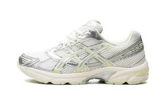 The Women’s ASICS Gel-1130 “Silver/Green” is a women’s-exclusive colorway of the casual shoe with a clean, versatile design.  The Women’s ASICS Gel-1130 “Silver/Green” features a white open-mesh construction with Green and Metallic Silver synthetic leather overlays.  A “Gel-1130” logo appears on the tongue and “Gel” is spelled out on the inserts on the collar overlay.  A techy-looking midsole with ASICS’s Gel cushioning technology completes the look of the popular sneaker. White Asics, 70s Converse, Adidas Campus 80s, Nike X Travis Scott, Ugg Ultra Mini, Converse Run Star Hike, Converse Run, Converse Run Star, Nike Shox