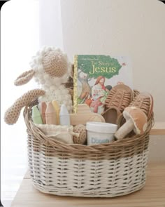 a basket filled with toys and books on top of a table