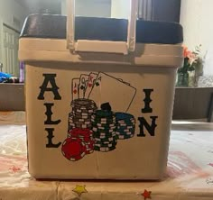 a cooler that has some playing cards on it