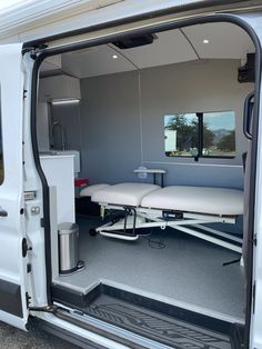 the back door of a van with an empty table in it