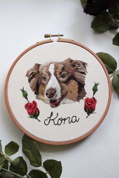 a cross stitch pattern with a dog's face and the word kora on it