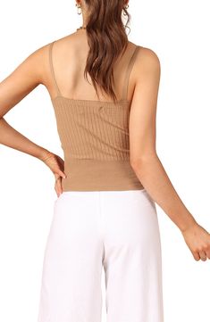 Effortlessly chic whether layered or solo, this V-neck tank is knit in a slinky rib stitch in a fitted silhouette. V-neck 45% polyester, 32% viscose, 23% nylon Hand wash, dry flat Imported Summer V-neck Crop Top For Layering, Beige Ribbed V-neck Top, Chic Summer Camisole With Seamless Construction, Chic Seamless Summer Camisole, Chic Summer Seamless Camisole, Ribbed Cami Camisole, Spring Beige Stretch Camisole, Chic Camisole Tank Top For Fall, Chic Summer Tops With Seamless Construction