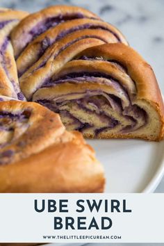 a blueberry swirl bread on a white plate