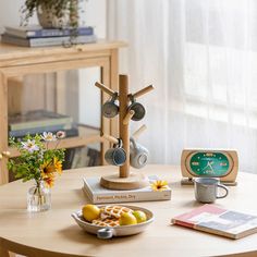 a wooden table topped with a plate of food and a clock on top of it