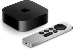 an apple tv and remote sitting next to each other