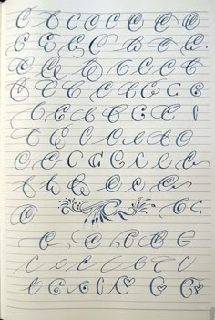 an open notebook with cursive writing on the page and numbers written in blue ink