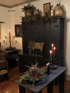 a living room filled with furniture and candles