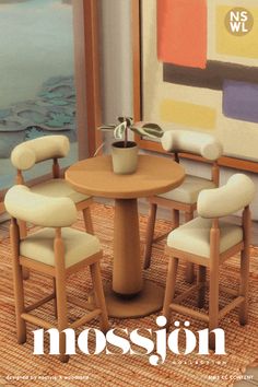 a magazine cover with three chairs and a table in front of a painting on the wall