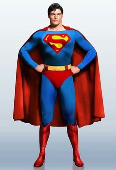 a man in a superman costume standing with his hands on his hips and wearing a red cape