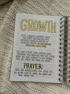 a note book with the words growth written in gold and black on top of it