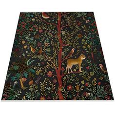 an intricately designed rug with animals and trees